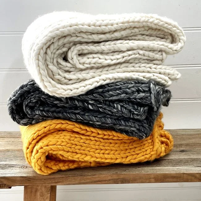 Cotton blankets for breathability and a lightweight feelChunky Handknit Throw Rug