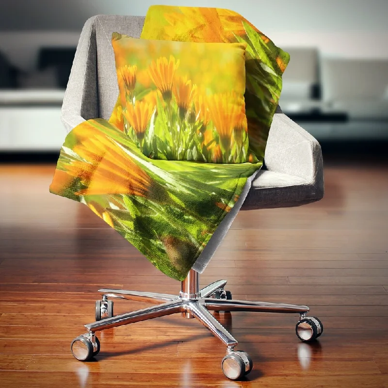 Fleece blankets for a cozy and plush textureDesignart 'Orange Marigold Flowers in Sunlight' Floral Throw Blanket